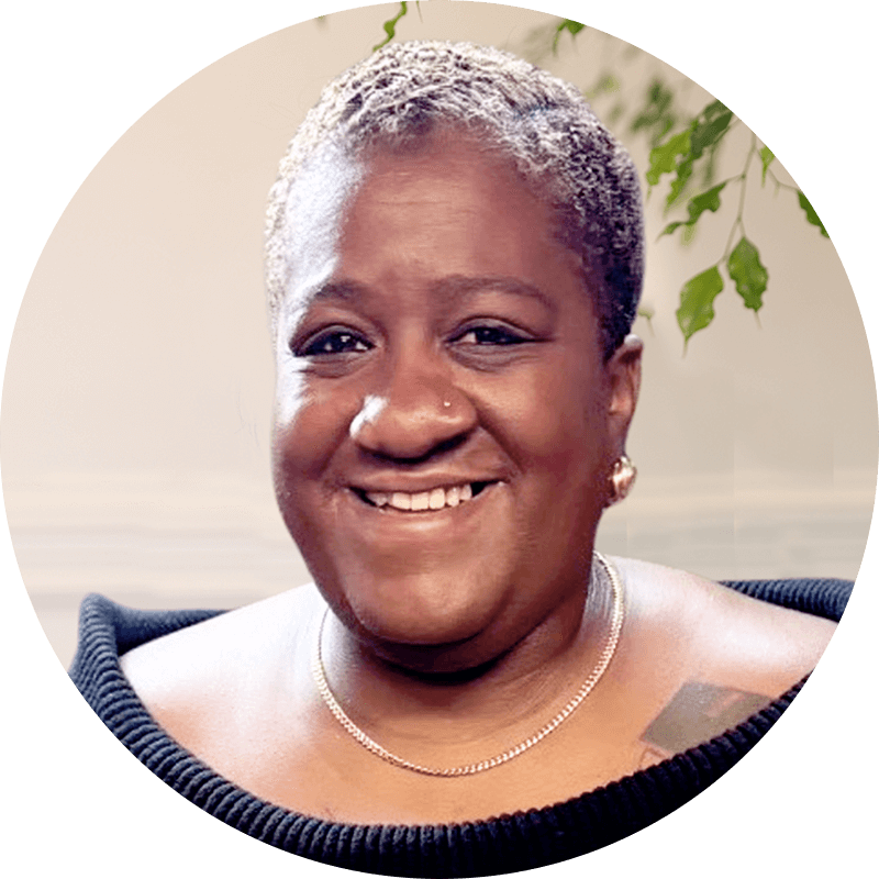 Stacia-Ponce-Rodriguez-1 - Lonestar Mental Health Stacia Ponce Rodriguez smiling portrait. Single post image of a happy woman with short grey hair and a nose piercing.